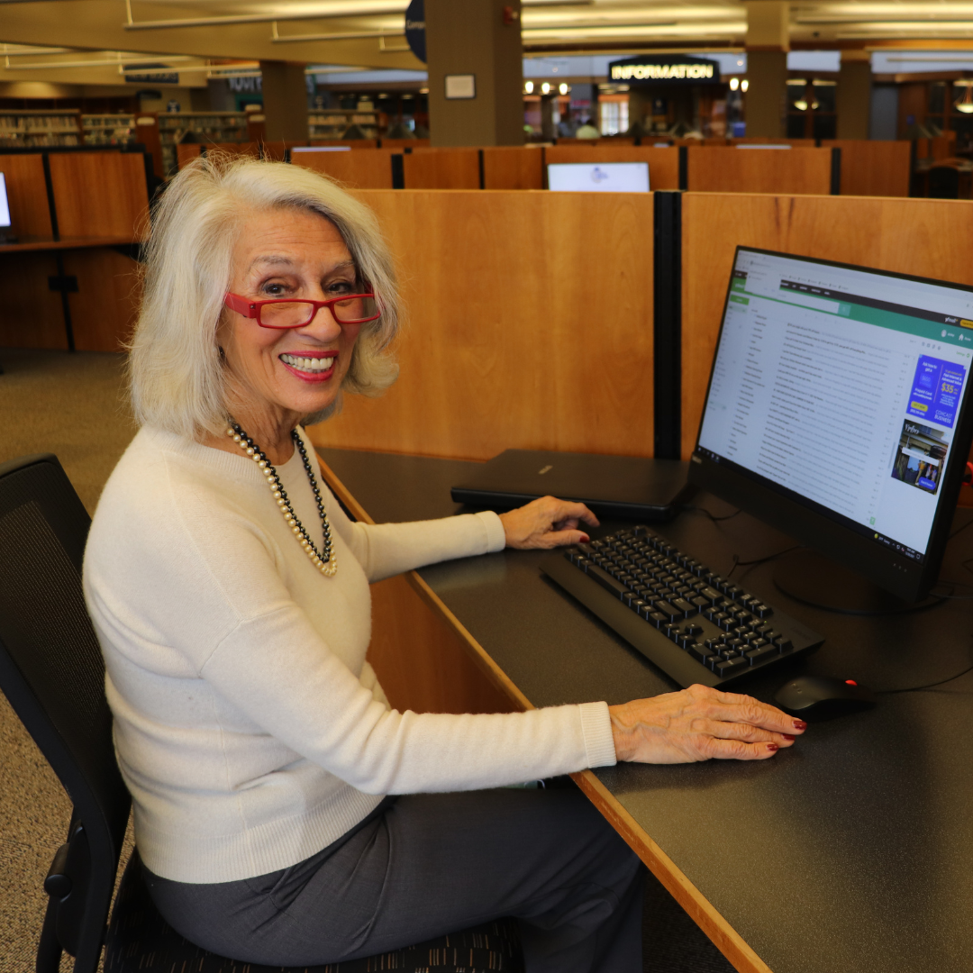 A woman on a computer at the Main Library