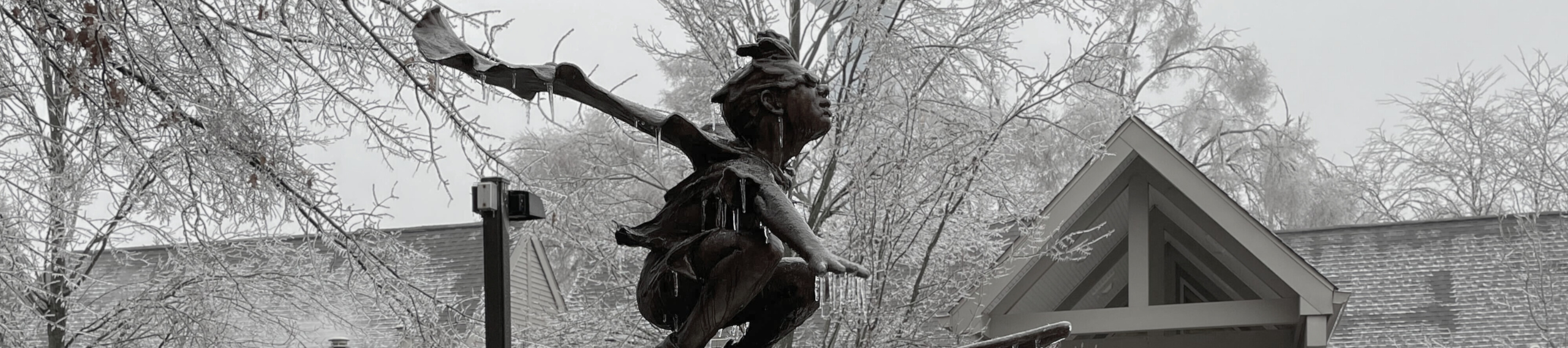 Statue outside the Westacres Branch covered in ice