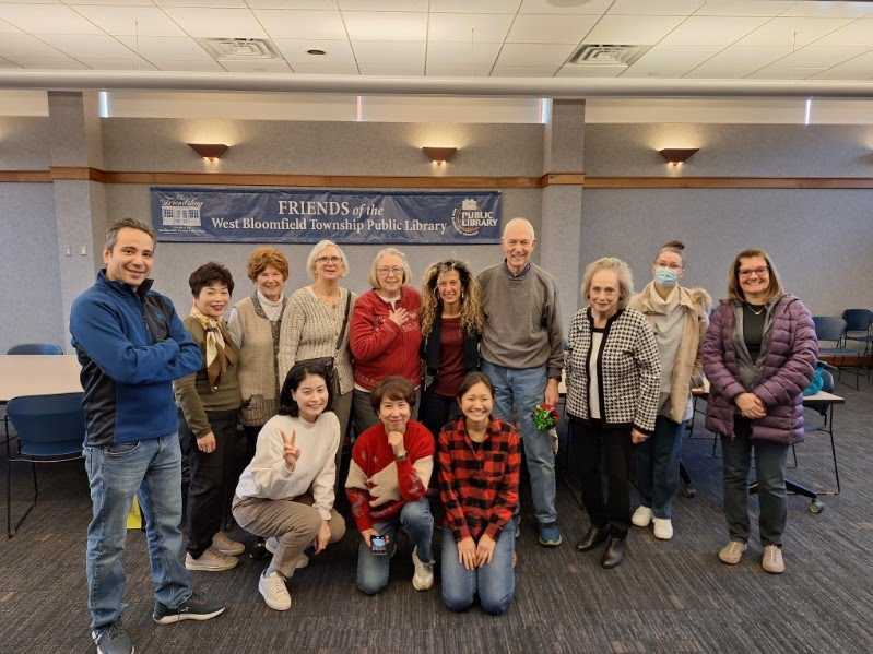 A group of people smile at the camera.