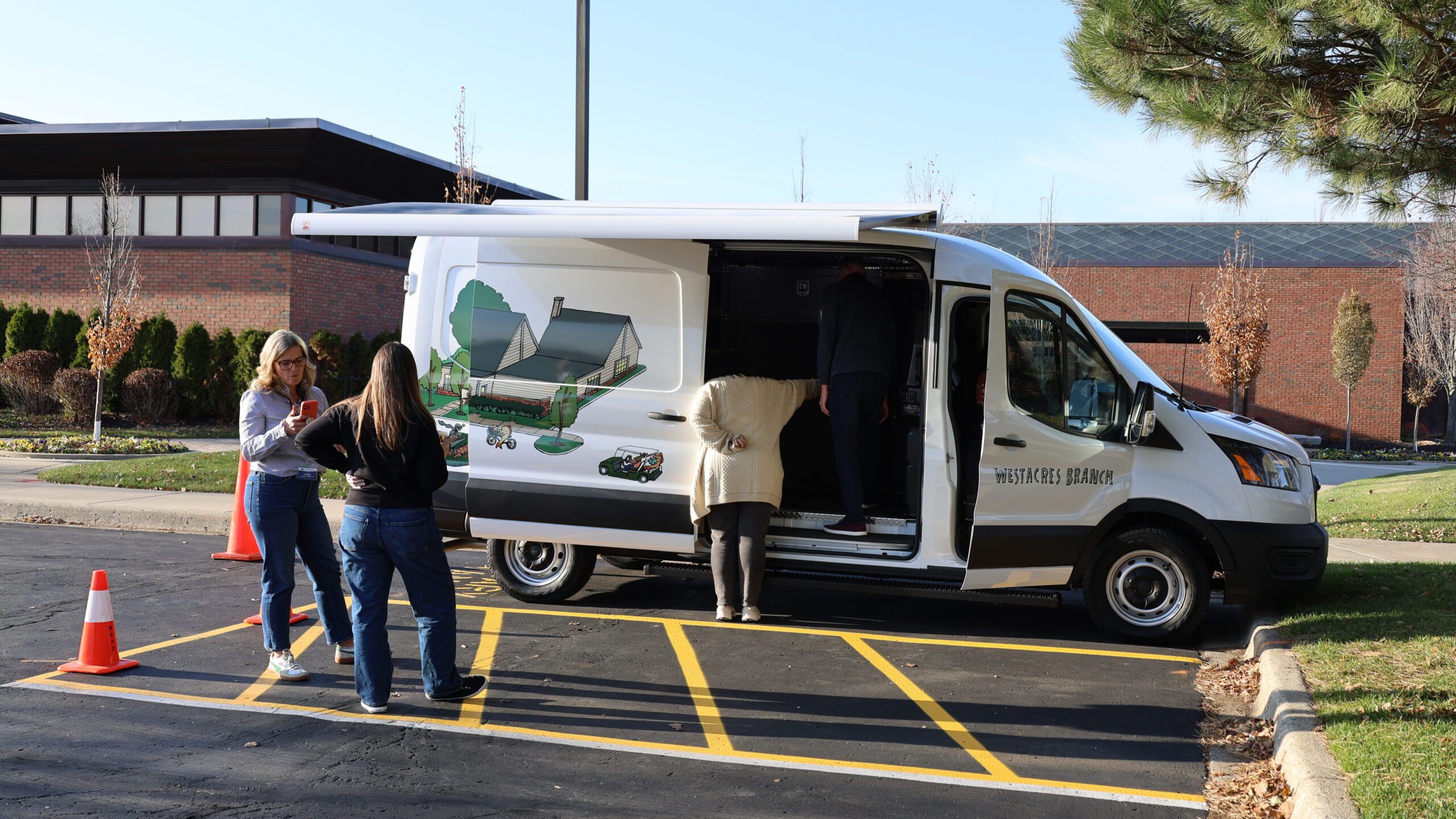 The outreach van open while parked outside the Main Library