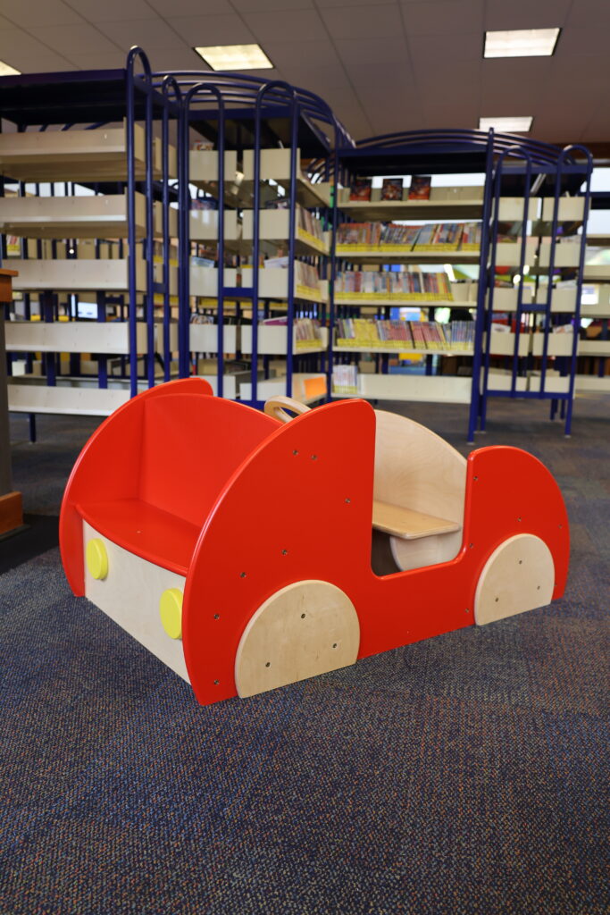 Wooden car play structure in the Youth Room at the Main Library